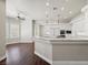 Open-concept kitchen featuring marble counters, breakfast bar and stainless steel appliances at 1840 Myrtle Island Dr, Las Vegas, NV 89117