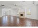 Spacious living room with hardwood floors and a charming stone fireplace at 1840 Myrtle Island Dr, Las Vegas, NV 89117