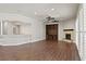 Expansive living room with hardwood floors, fireplace, and breakfast bar at 1840 Myrtle Island Dr, Las Vegas, NV 89117