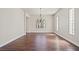 Spacious living room featuring hardwood floors and a charming chandelier at 1840 Myrtle Island Dr, Las Vegas, NV 89117