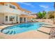 Backyard swimming pool and hot tub with seating, complemented by the well-maintained home exterior at 1840 Myrtle Island Dr, Las Vegas, NV 89117