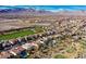 Aerial view of homes backing on golf course, highlighting community and desert views at 1994 Orchard Mist St, Las Vegas, NV 89135
