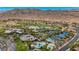 Aerial view of the community featuring a golf course, a lake and tennis courts at 1994 Orchard Mist St, Las Vegas, NV 89135