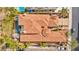 Aerial view of a luxury home with a tile roof, swimming pool, spa and outdoor kitchen at 1994 Orchard Mist St, Las Vegas, NV 89135