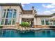 Beautiful backyard features a pool, patio, and exterior elevation at 1994 Orchard Mist St, Las Vegas, NV 89135