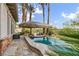 Backyard features a pool, barbecue grill, and covered seating at 1994 Orchard Mist St, Las Vegas, NV 89135
