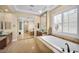 Bright bathroom with jetted tub, double vanities, and custom cabinets at 1994 Orchard Mist St, Las Vegas, NV 89135