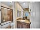 Well-appointed bathroom featuring a vanity with granite countertops and a shower with glass doors at 1994 Orchard Mist St, Las Vegas, NV 89135