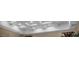A modern recessed lighting design on a vaulted ceiling provides an elegant aesthetic and ambient light at 1994 Orchard Mist St, Las Vegas, NV 89135