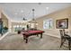 The game room features a billiards table, bar seating, and a seating area in the background at 1994 Orchard Mist St, Las Vegas, NV 89135