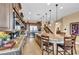 Well-equipped kitchen featuring granite counters, stainless steel appliances, and island seating, perfect for modern living at 1994 Orchard Mist St, Las Vegas, NV 89135