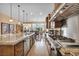 Spacious kitchen with stainless steel appliances, granite countertops, and a large island at 1994 Orchard Mist St, Las Vegas, NV 89135