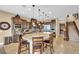 Spacious kitchen features a granite island, wooden cabinetry, and stainless steel appliances at 1994 Orchard Mist St, Las Vegas, NV 89135