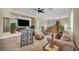 The upstairs living room is well-lit and features plush seating and views of the home's exterior at 1994 Orchard Mist St, Las Vegas, NV 89135