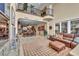 Open concept living room features a fireplace, balcony and comfortable leather seating at 1994 Orchard Mist St, Las Vegas, NV 89135