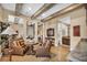 Cozy living room with exposed wood beams, and views into the bedroom and bathroom at 1994 Orchard Mist St, Las Vegas, NV 89135
