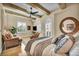 Bright main bedroom featuring exposed wood beams, a seating area, and plenty of natural light at 1994 Orchard Mist St, Las Vegas, NV 89135