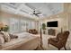 Bright main bedroom features a trey ceiling, plantation shutters, and sitting area at 1994 Orchard Mist St, Las Vegas, NV 89135