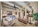Spacious main bedroom suite with exposed wood beams, sitting area, and ample natural light at 1994 Orchard Mist St, Las Vegas, NV 89135