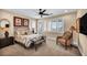 The main bedroom includes an accent chair and a bench in front of the bed at 1994 Orchard Mist St, Las Vegas, NV 89135