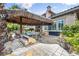 Backyard features a tiki hut, grill, and outdoor kitchen area at 1994 Orchard Mist St, Las Vegas, NV 89135