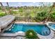 This aerial view shows a freeform pool with swim-up bar and rock features at 1994 Orchard Mist St, Las Vegas, NV 89135