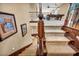 Carpeted staircase with wooden banister leading to the upstairs living area at 1994 Orchard Mist St, Las Vegas, NV 89135