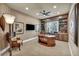Well-appointed study with built-in bookshelves, a large desk, and textured wallpaper at 1994 Orchard Mist St, Las Vegas, NV 89135