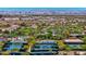 Tennis court and swimming pool facilities in a lush community with desert surroundings at 1994 Orchard Mist St, Las Vegas, NV 89135