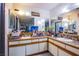 Large bathroom with dual sinks, tile countertops, and ample storage space at 2080 Karen Ave # 9, Las Vegas, NV 89169