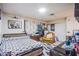 Cozy bedroom featuring a comfortable bed, armchair, and neutral decor at 2080 Karen Ave # 9, Las Vegas, NV 89169
