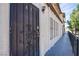 Exterior view of unit A9 with a security door and textured facade on a sunny day at 2080 Karen Ave # 9, Las Vegas, NV 89169
