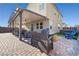 Spacious backyard with a covered patio, seating, and hot tub, perfect for outdoor entertaining at 2127 Brewer Ave, North Las Vegas, NV 89081