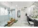 Large bathroom showing walk in shower and dual sink vanities with wall paper at 2127 Brewer Ave, North Las Vegas, NV 89081