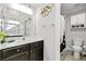 Well-lit bathroom with sleek fixtures, quartz countertops, and a tiled shower at 2127 Brewer Ave, North Las Vegas, NV 89081