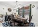 Formal dining room with a dark wood table, chandelier, and decorative wall art at 2127 Brewer Ave, North Las Vegas, NV 89081