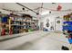 Spacious garage with ample storage shelves and neatly organized items and bicycles at 2127 Brewer Ave, North Las Vegas, NV 89081