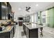 Stylish kitchen with a large center island, sleek appliances, and an open layout to the living area at 2127 Brewer Ave, North Las Vegas, NV 89081