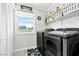 Well-organized laundry room featuring modern appliances and ample storage space at 2127 Brewer Ave, North Las Vegas, NV 89081