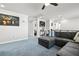 Open-concept living area featuring plush carpeting and stylish decor at 2127 Brewer Ave, North Las Vegas, NV 89081