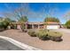 Charming single-story brick home with a well-manicured front yard and a two-car garage at 2246 Almart Cir, Henderson, NV 89014