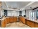 Charming kitchen featuring oak cabinets, granite counters and stainless appliances at 2246 Almart Cir, Henderson, NV 89014