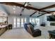 Spacious living room features exposed wood beams, fireplace, and backyard access at 2246 Almart Cir, Henderson, NV 89014