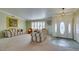 Bright and spacious living room featuring large windows, neutral walls, and an elegant entry at 2246 Almart Cir, Henderson, NV 89014