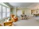 Bright and airy living room featuring large windows, neutral walls, and comfortable seating at 2246 Almart Cir, Henderson, NV 89014