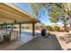 Covered patio with outdoor furniture, ceiling fan, and view of the pool and yard at 2246 Almart Cir, Henderson, NV 89014