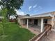The backyard features a covered patio and a well-manicured lawn, ideal for outdoor enjoyment at 228 Hiawatha Way, Mesquite, NV 89027
