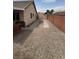 Property featuring a gravel area, brick fence, and side yard gate at 228 Hiawatha Way, Mesquite, NV 89027