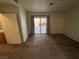 Bedroom with sliding glass doors to the backyard and neutral carpet at 228 Hiawatha Way, Mesquite, NV 89027