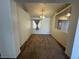 Bright dining area with neutral walls, carpeted floor, and an elegant chandelier at 228 Hiawatha Way, Mesquite, NV 89027